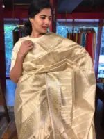 Gold Silver Tissue Silk Saree highlighted with Zari Buttis