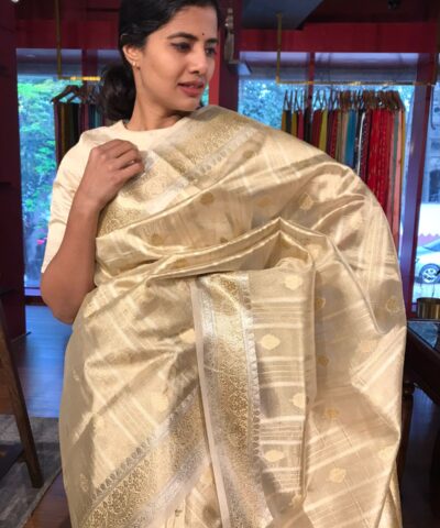 Gold Silver Tissue Silk Saree highlighted with Zari Buttis