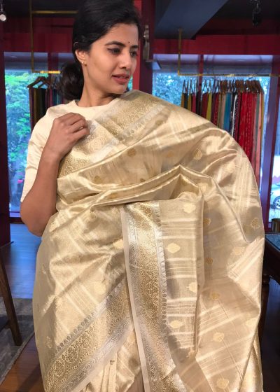 Gold Silver Tissue Silk Saree highlighted with Zari Buttis