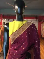 Wine Crepe Silk Saree with Beautiful Gold Zari Buttas highlighted with Gold Woven Border