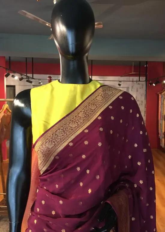 Wine Crepe Silk Saree with Beautiful Gold Zari Buttas highlighted with Gold Woven Border