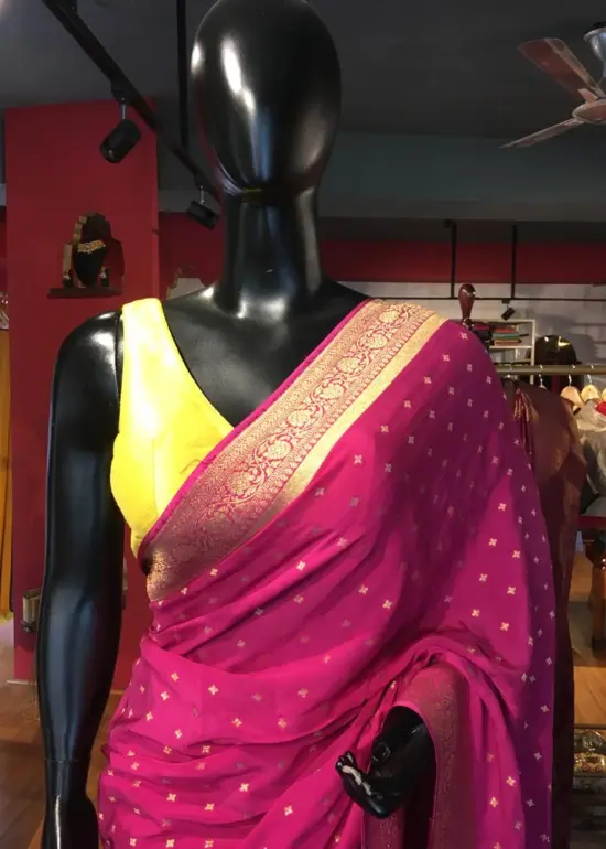 Pink Crepe Silk Saree with Beautiful Gold Zari Buttas highlighted with Gold Woven Border