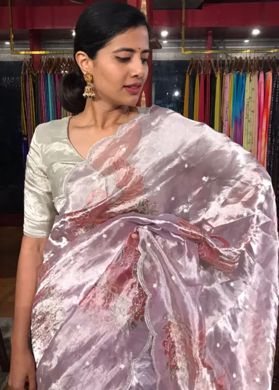 Lilac Hand Embroidered and Hand painted Tissue Silk Saree highlighted with Scalloped Border