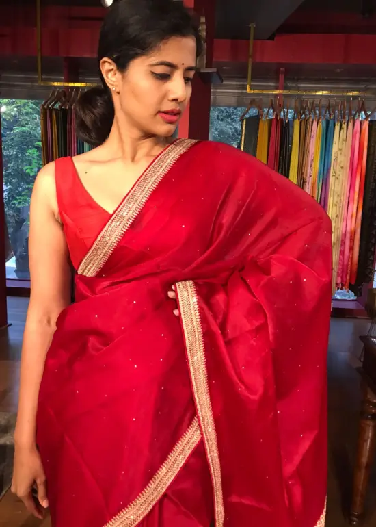 Scarlet Red Organza Silk Saree with beautiful hand embroidered border adorned with Badla work