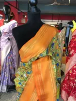 Green Printed Banarasi Silk Saree highlighted with contrast border