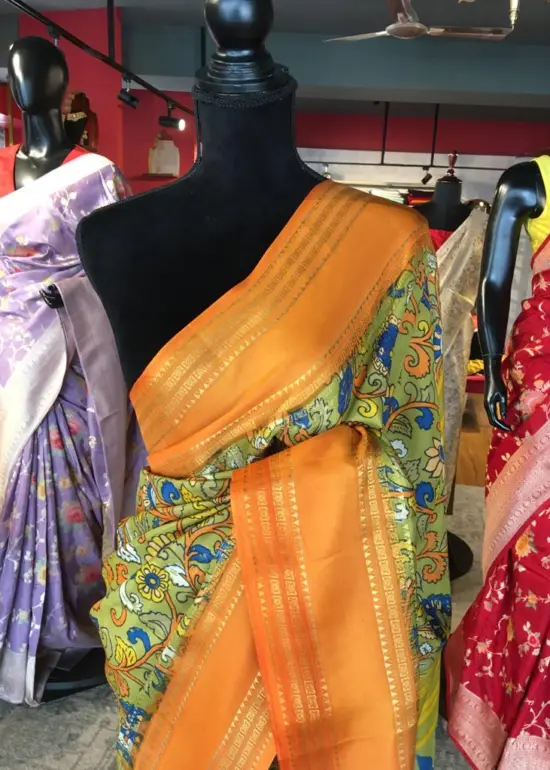 Green Printed Banarasi Silk Saree highlighted with contrast border