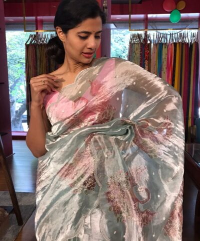 Blue Hand Embroidered and Hand painted Tissue Silk Saree highlighted with Scalloped Border