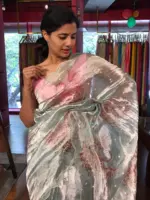 Blue Hand Embroidered and Hand painted Tissue Silk Saree highlighted with Scalloped Border