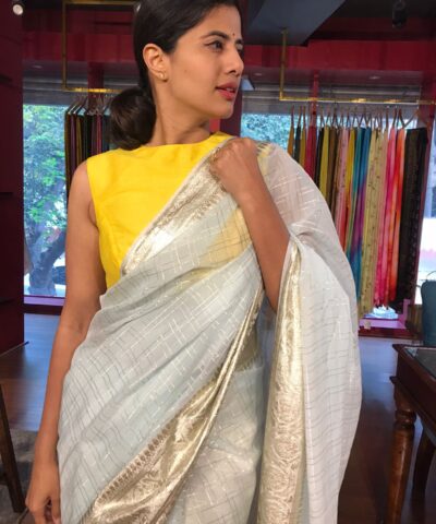 Powder Blue Georgette Saree highlighted with Zari Border