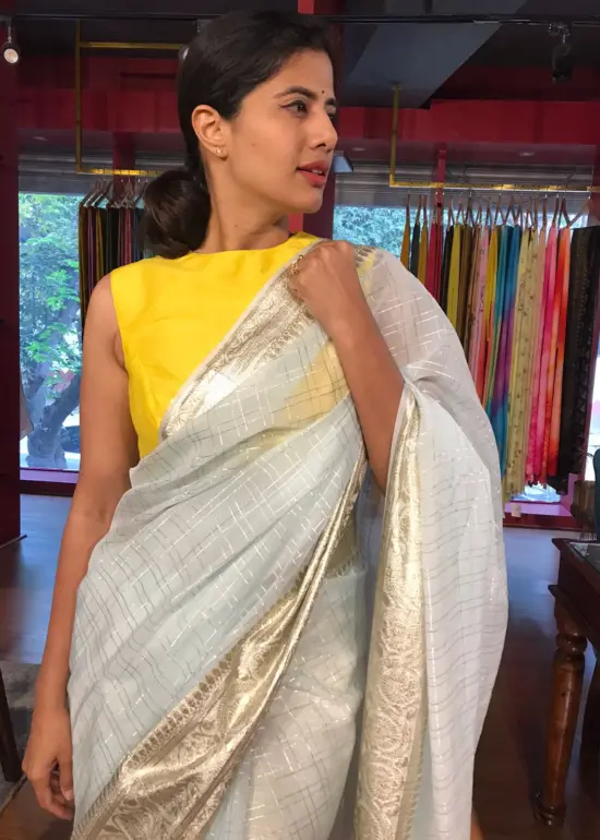 Powder Blue Georgette Saree highlighted with Zari Border