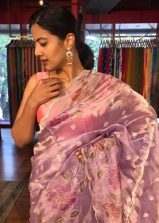 Purple Hand Embroidered and Hand painted Tissue Silk Saree highlighted with Scalloped Border