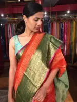 Tomato Red Organza Silk Saree highlighted with Kanchi Zari Border