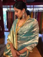 Sky Blue Dual Tone Tissue Silk Saree highlighted with Zari Motifs and Gota Border