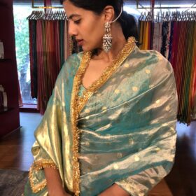 Sky Blue Dual Tone Tissue Silk Saree highlighted with Zari Motifs and Gota Border