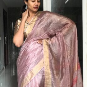 Onion Pink Tissue Silk Saree Embellished with Sequins highlighted with contrast Gold Zari Border