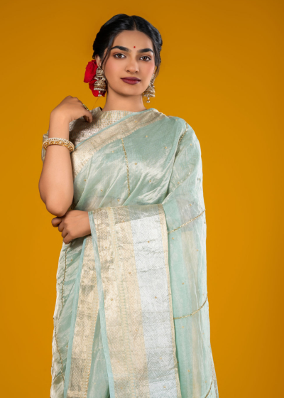 Sea Green Handloom Organza Silk Saree Highlighted with Kanchi Zari Border and Sequins Embroidery all over