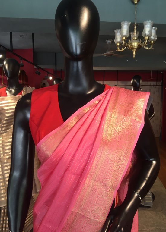 Pink Chiffon Silk Saree highlighted with Striped and Gold Zari Border