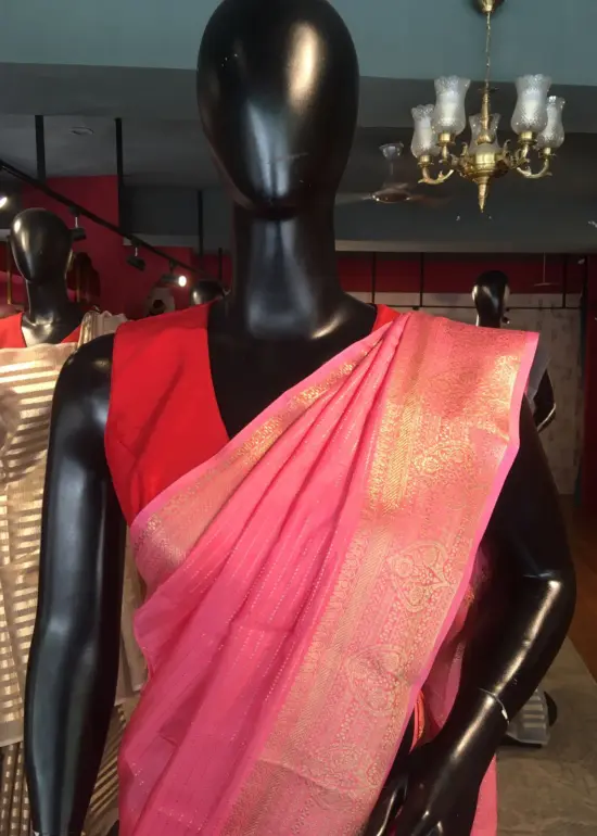 Pink Chiffon Silk Saree highlighted with Striped and Gold Zari Border