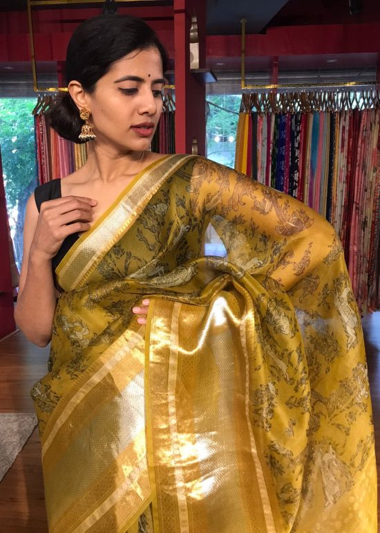 Yellow Printed Organza Silk Saree highlighted with Kanchi Silk Zari Weaves