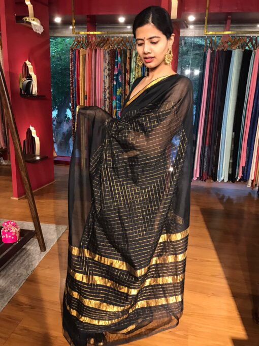 Side view of a model showcasing Black Handwoven Mangalagiri Chequered Silk Saree, Suitable for Pop-Up Events By Mirra Clothing