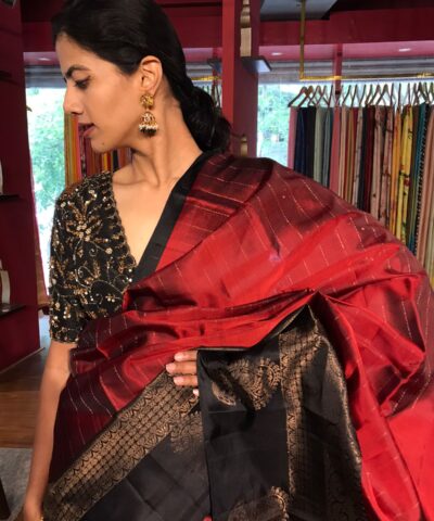 Arakku Red Kanchivaram Silk Saree with Readymade Intricate Embroidered Black Raw Silk Blouse
