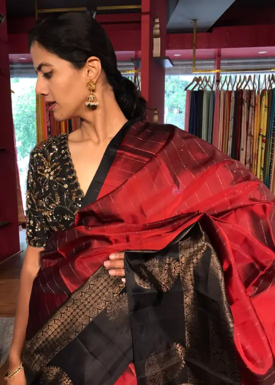 Arakku Red Kanchivaram Silk Saree with Readymade Intricate Embroidered Black Raw Silk Blouse