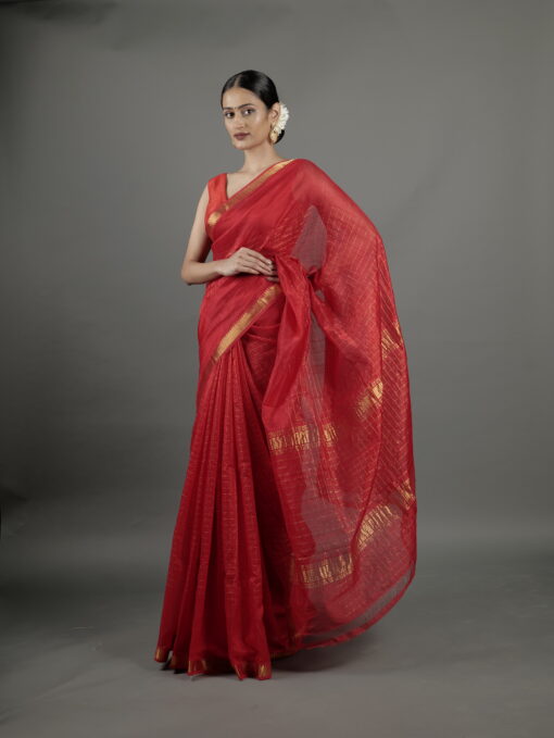 Side view of a model showcasing Red Handwoven Mangalagiri Chequered Silk Saree, Suitable For Cultural Gatherings & Temple Visits By Mirra Clothing