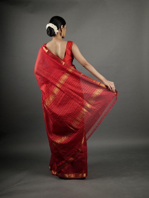 Back view of a model showcasing Red Handwoven Mangalagiri Chequered Silk Saree, Suitable For Traditional Office Events or Award Functions By Mirra Clothing