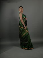 Side view of a model showcasing Bottle Green Chequered Handwoven Mangalagiri Silk Saree, Suitable for Formal Cultural Events by Mirra Clothing