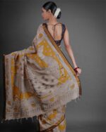 Back view of a model showcasing Yellow Kalamkari Printed Mangalagiri Silk Saree, Suitable for Weddings By Mirra Clothing