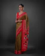 Side view of a model showcasing Moss Green Printed Georgette Saree with Chikankari Weaves , Suitable for pujas or religious gatherings By Mirra Clthing