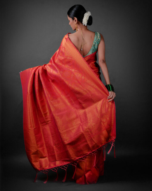 Back view of a model showcasing Pink Banarasi Silk Saree with Zari Weaves , Perfect for outdoor events By Mirra Clothing