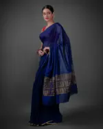 Side view of a model showcasing Navy Blue Chiffon Silk Saree , Ideal for relaxed outings By Mirra Clothing