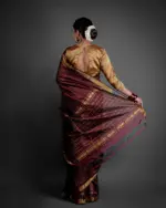 "Detailed view of the pallu of a Mangalagiri silk saree, featuring bold designs and bright hues."By MirraClothing