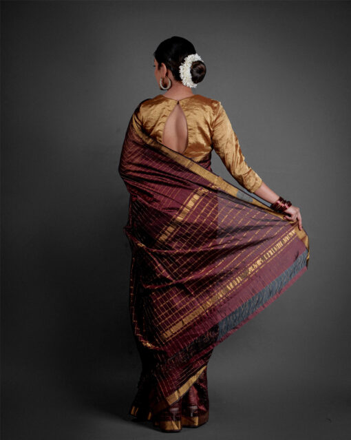 "Detailed view of the pallu of a Mangalagiri silk saree, featuring bold designs and bright hues."By MirraClothing