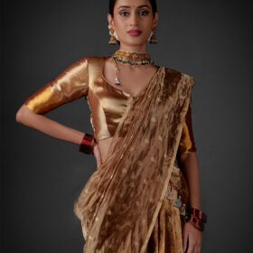 Front view of a model showcasing a Molten Gold Tissue Silk Half Saree Set with Dupatta and Blouse, Suitable for cultural festivities By Mirra Clothing