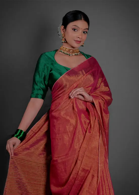 Close up view of a model showcasing Ombre Red Tissue Linen Saree , Suitable for social events By Mirra Clothing