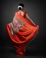 Back view of a model showcasing Green Banarasi Silk Saree Highlighted with Kalamkari Prints , designed for elegance at any party. By Mirra Clothing