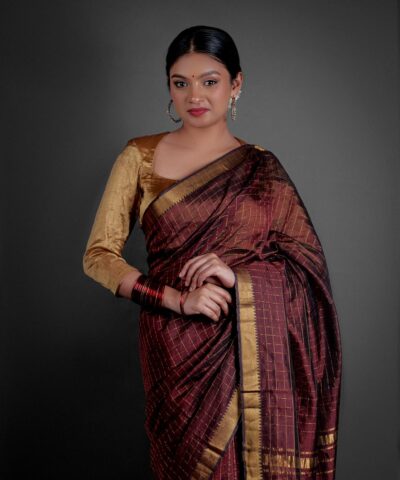 "Traditional Mangalagiri silk saree in rich colors with distinctive geometric patterns."By Mirra Clothing