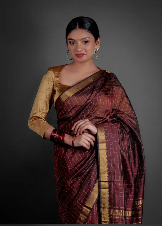"Traditional Mangalagiri silk saree in rich colors with distinctive geometric patterns."By Mirra Clothing