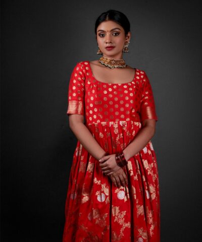 "Close-up of the flowing fabric of a Banarasi georgette dress, showcasing its luxurious texture."By Mirra Clothing