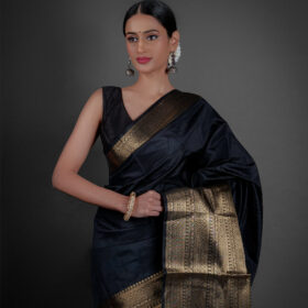 "A luxurious Banarasi saree in deep gold, adorned with intricate zari work and traditional perfect for festive occasions."by Mirra Clothing