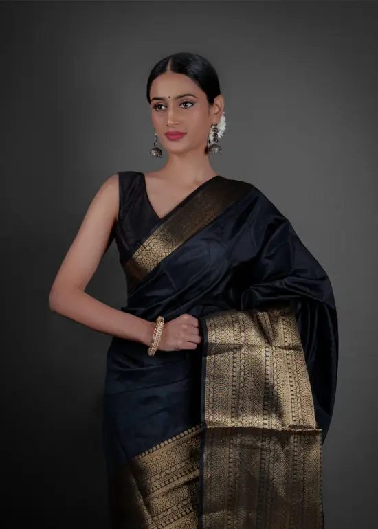 "A luxurious Banarasi saree in deep gold, adorned with intricate zari work and traditional perfect for festive occasions."by Mirra Clothing