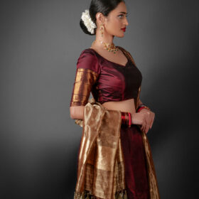 Side view of a model showcasing Coffee Brown Silk Half Saree Set with Tissue Silk Dupatta, Designed for festive wedding occasions By Mirra Clothing