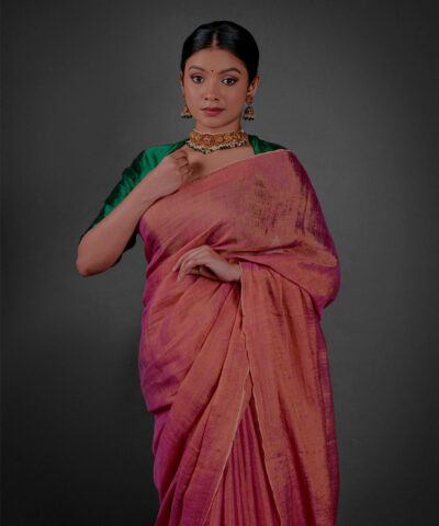 Close up view of a model showcasing Ombre Pink Tissue Linen Saree , elegant for grand occasions By Mirra Clothing