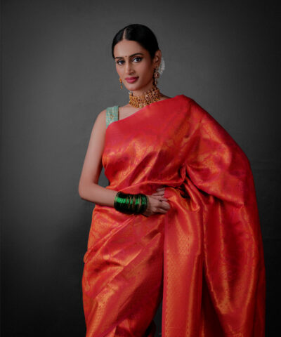 Front view of a model showcasing a Pink Banarasi Silk Saree with Zari Weaves , Elegant for family rituals and celebrations. By Mis=rra clothing