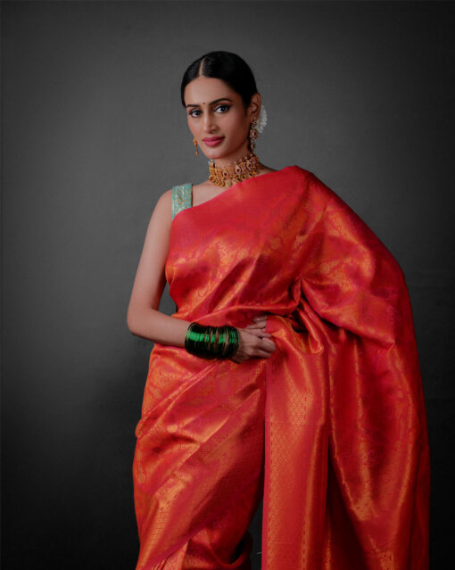 Front view of a model showcasing a Pink Banarasi Silk Saree with Zari Weaves , Elegant for family rituals and celebrations. By Mis=rra clothing