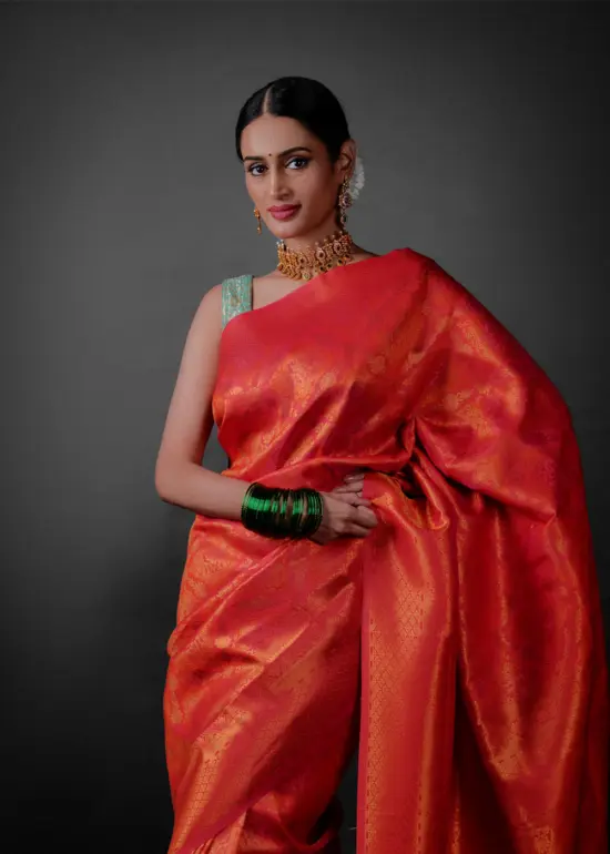 Front view of a model showcasing a Pink Banarasi Silk Saree with Zari Weaves , Elegant for family rituals and celebrations. By Mis=rra clothing