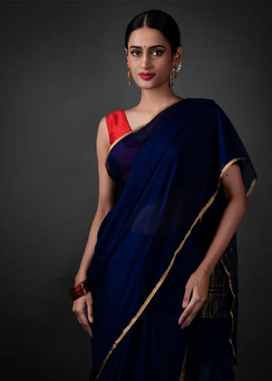 "Close up view of a model showcasing Navy Blue Chiffon Silk Saree , perfect for casual outings. By MirraClothing