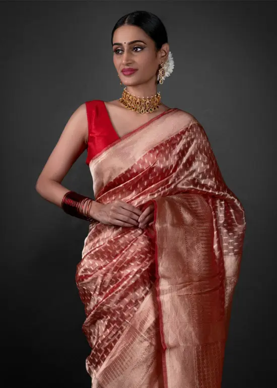 "Close-up of a luxurious red tissue saree showcasing Gold Buttis Saree By MirraClothing